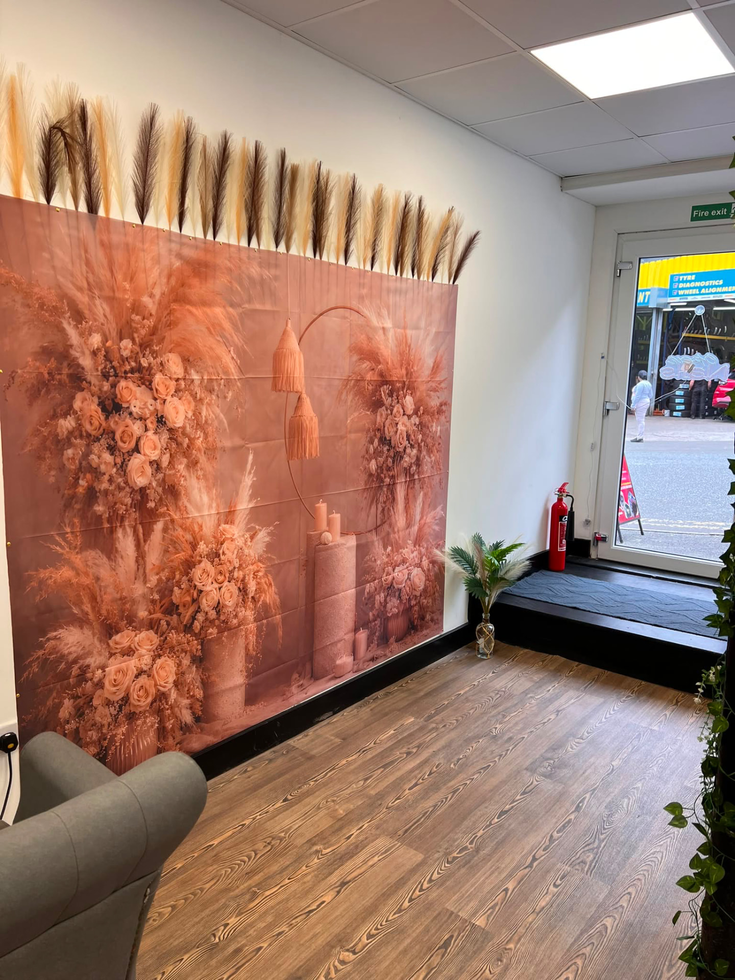 Floral photo wall inside Montana Beauty Empire